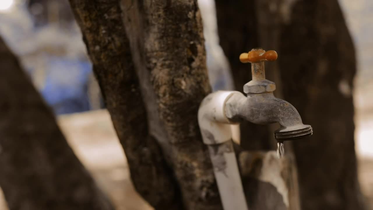 Stock Video A Man Closing A Faucet That Drips Closeup Live Wallpaper For PC