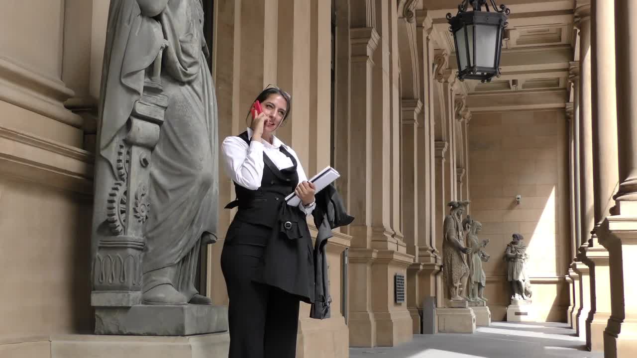 Stock Video Business Woman In The Exterior Hallway Of A Classic Building Live Wallpaper For PC