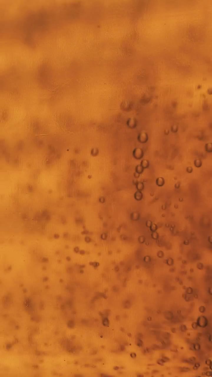 Stock Video Bubbles Moving Slowly In A Yellow Liquid Live Wallpaper For PC