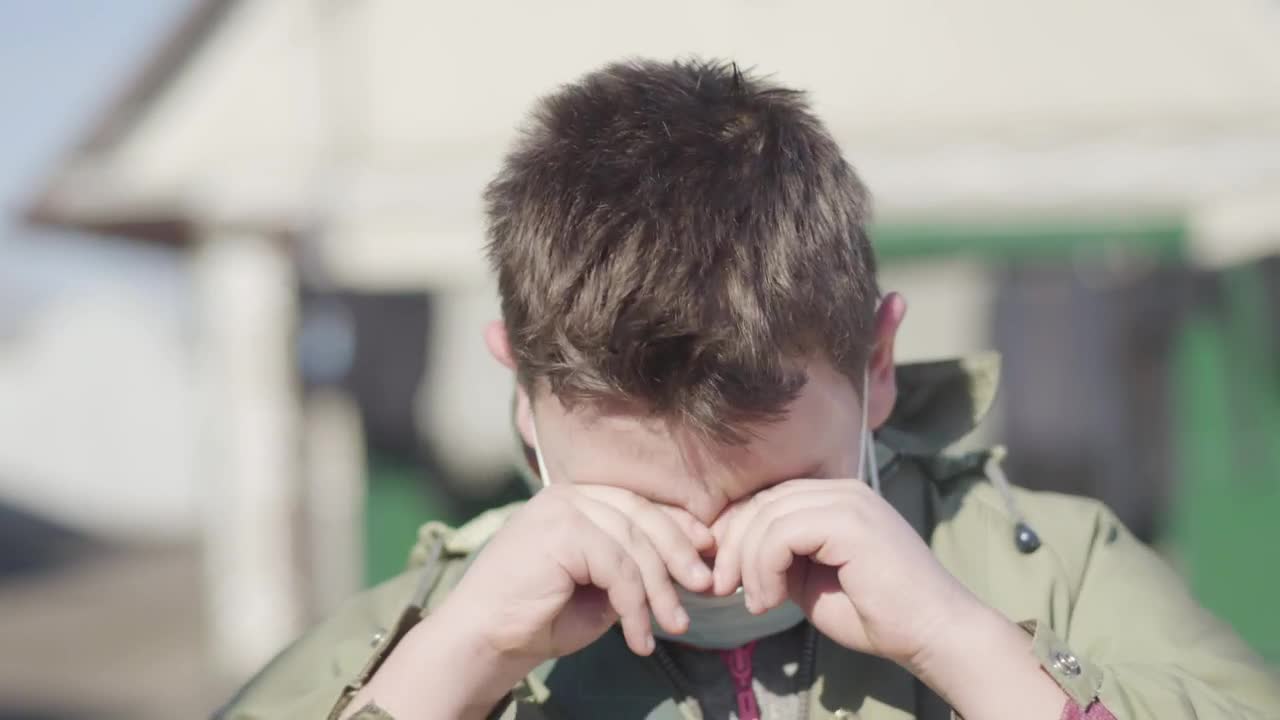 Stock Video Boy With Face Mask Coughs And Rubs His Eyes Live Wallpaper For PC