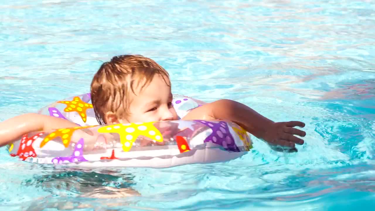 Stock Video Boy Swimming With A Plastic Ring Live Wallpaper For PC