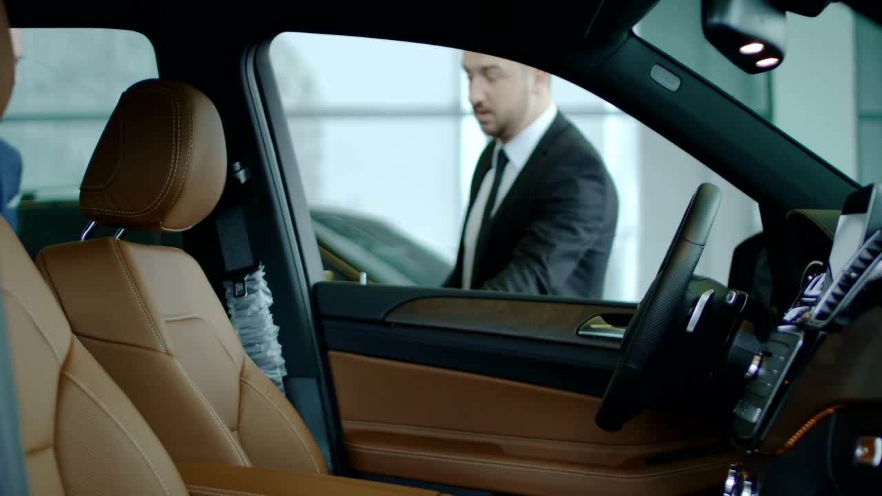 Video Stock Car Dealer Showing The Car To A Client Live Wallpaper For PC
