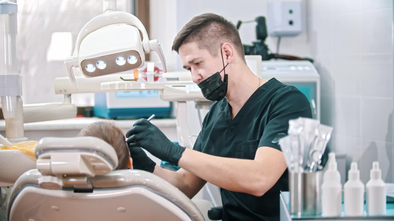 Stock Video Dentist In The Distance Attending To A Child Live Wallpaper For PC