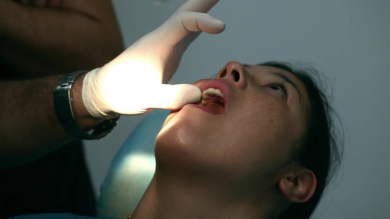 Stock Video Dentist Applying A Surgical Procedure Live Wallpaper For PC
