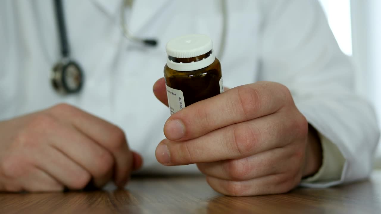 Stock Video Dcotor Opening A Bottle Of Pills Live Wallpaper For PC