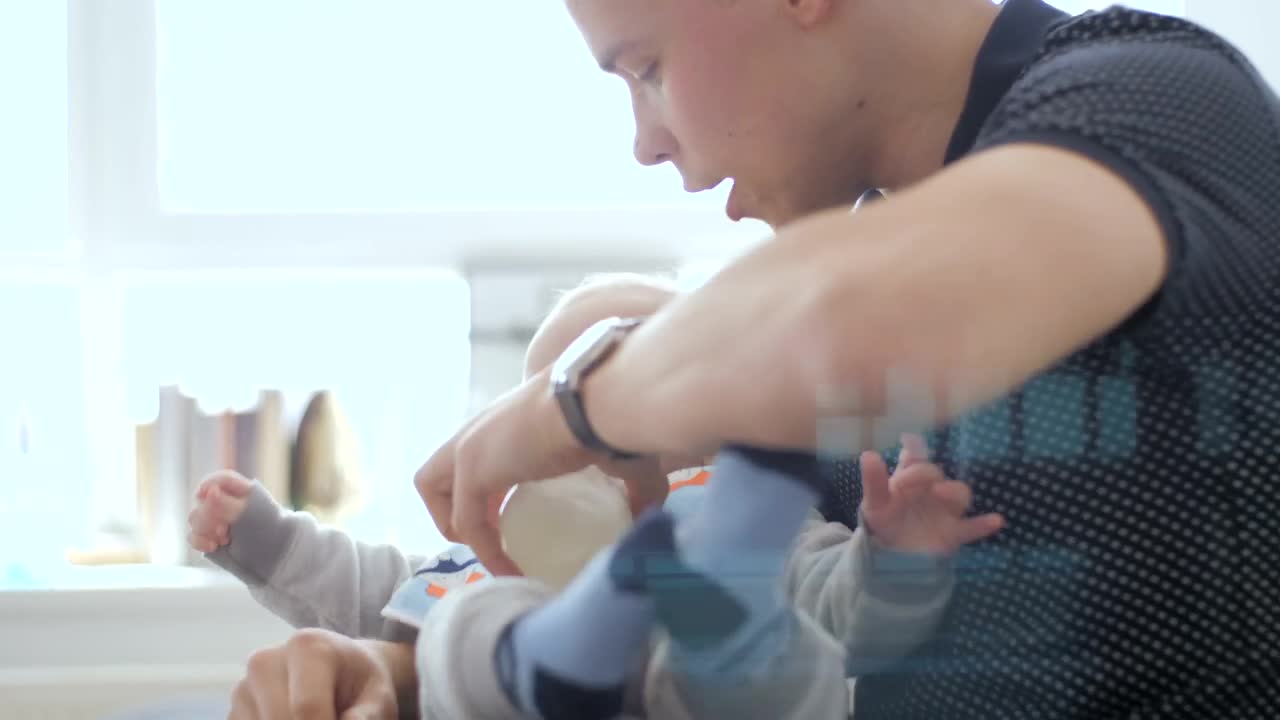 Stock Video Dad Feeding Baby With A Baby Bottle Live Wallpaper For PC