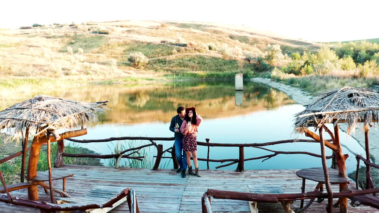 Stock Video Couple Sharing A Drink On A Pier Live Wallpaper For PC