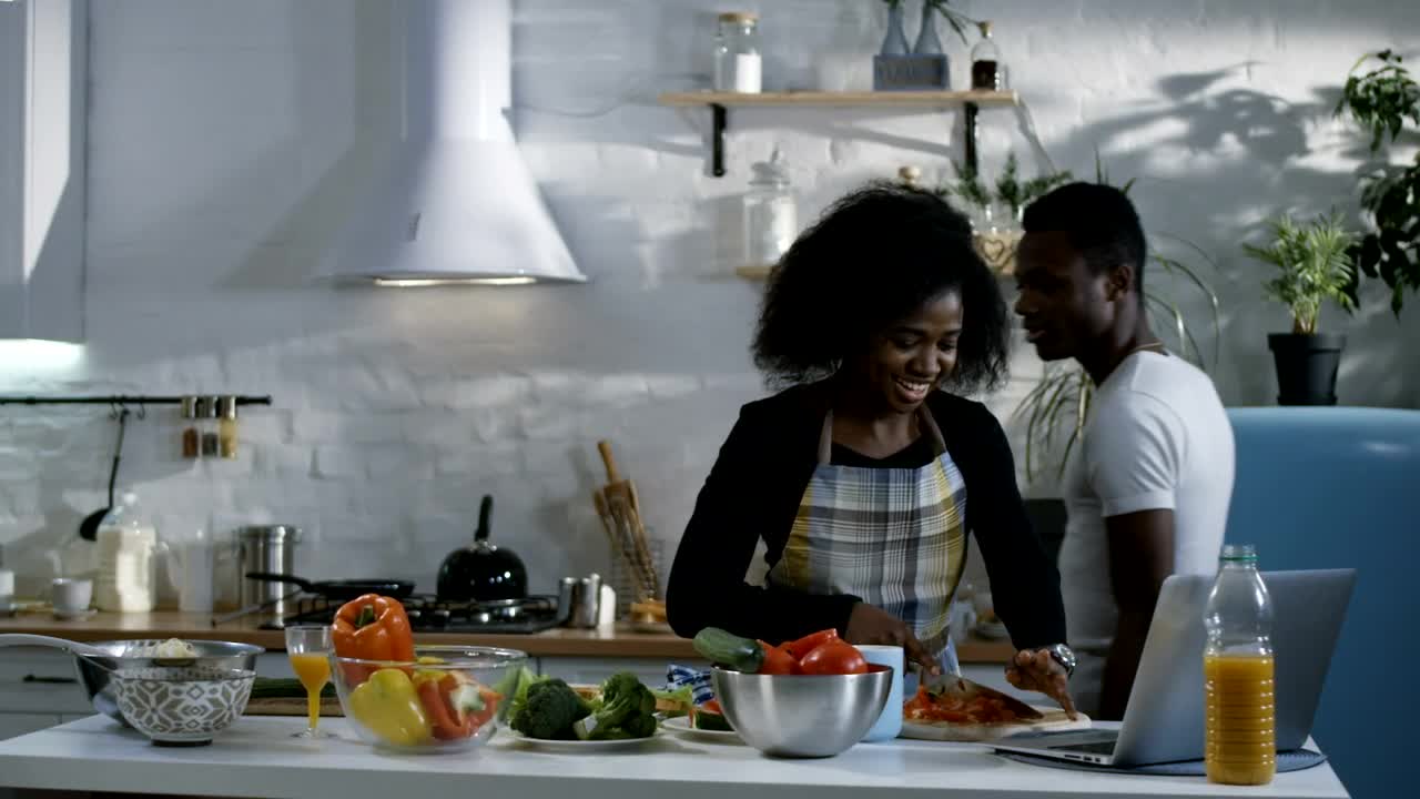 Stock Video Couple Preparing Food Following A Tutorial Live Wallpaper For PC