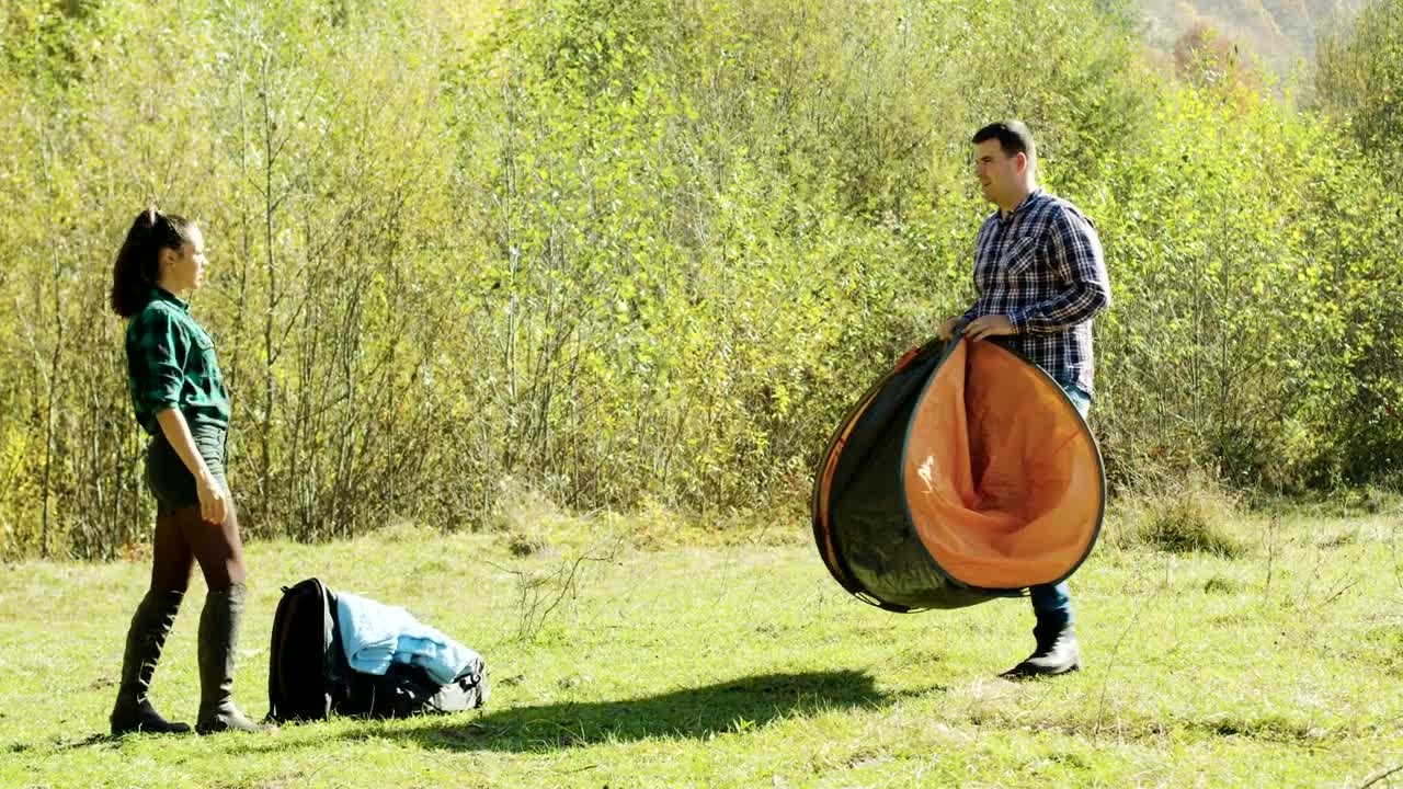 Stock Video Couple Preparing A Tent For The Night Live Wallpaper For PC
