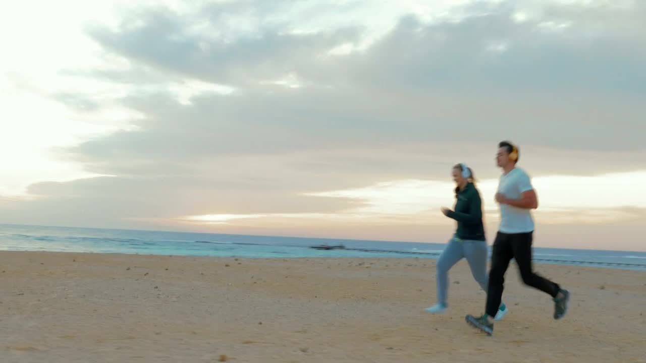 Stock Video Couple Out For A Run On The Beach Live Wallpaper For PC