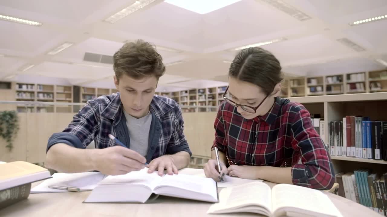 Stock Video Couple Of Students At The Library Live Wallpaper For PC