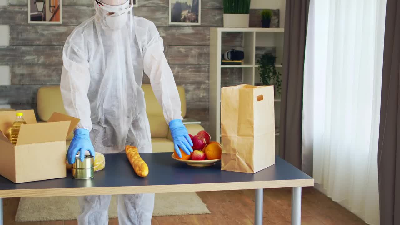 Stock Video Coronavirus Quaratine Grocery Delivery Man Packs Food Live Wallpaper For PC