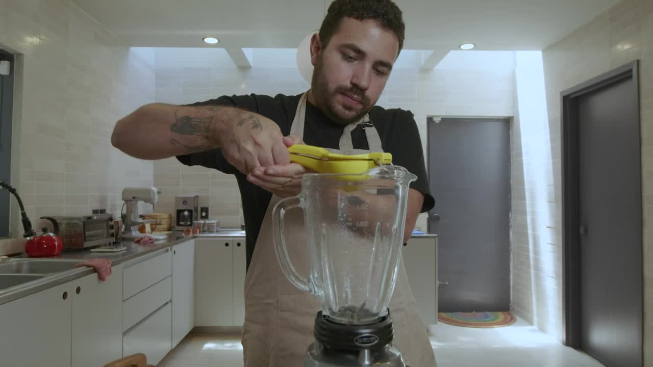 Stock Video Cook Adding Lemon To A Blender Live Wallpaper For PC