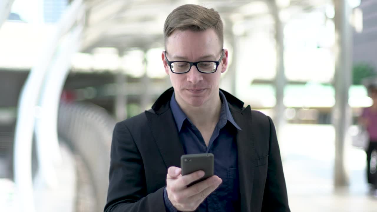 Stock Video Entrepreneur Young Man Wearing Glasses On A Call Live Wallpaper For PC