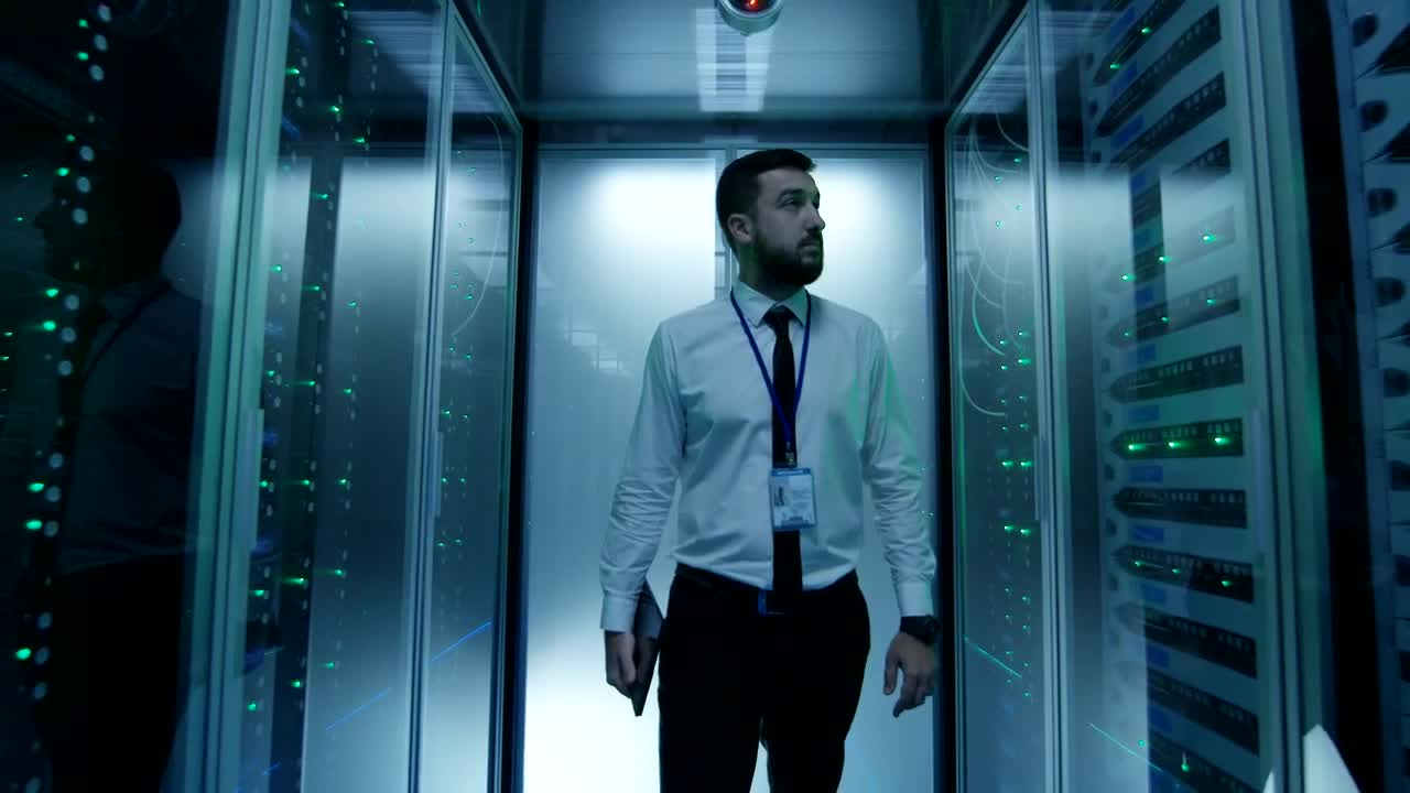 Stock Video Engineer Walking Among Server Racks Live Wallpaper For PC
