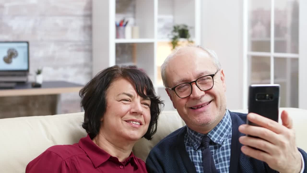 Stock Video Elderly Couple Taking A Photo Together At Home Live Wallpaper For PC