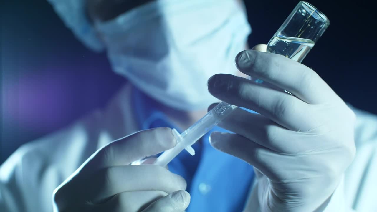 Stock Video Doctor Filling A Syringe With Anesthesia Live Wallpaper For PC