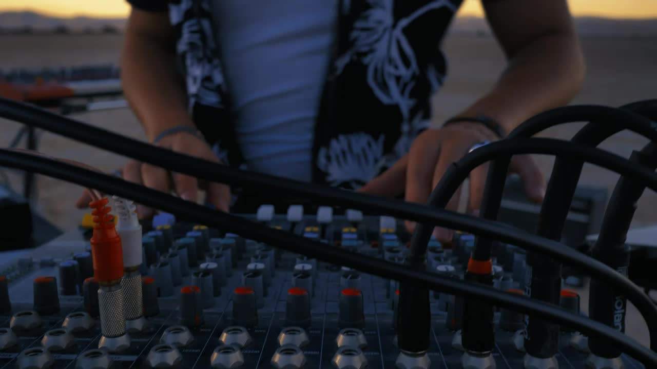 Stock Video Dj Using A Console Mixing In A Desert Live Wallpaper For PC