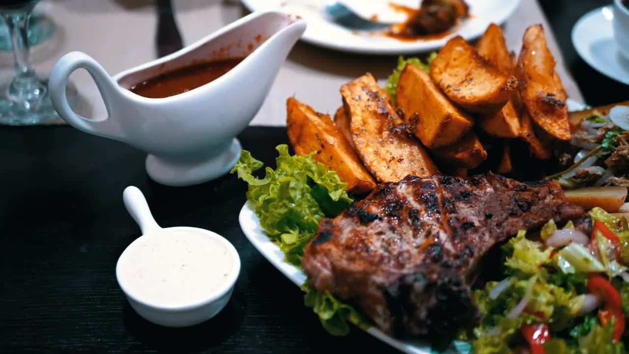 Stock Video Dish Of Meat Potatoes And Salad In A Restaurant Live Wallpaper For PC