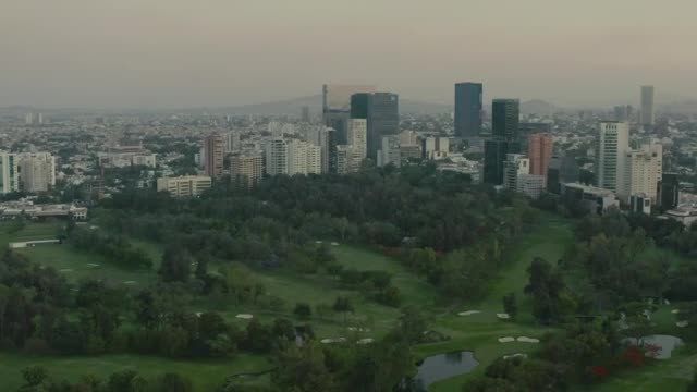 Stock Video Mixkit Flying Over A Large Park Surrounded By A Metropolis Smal Live Wallpaper For PC