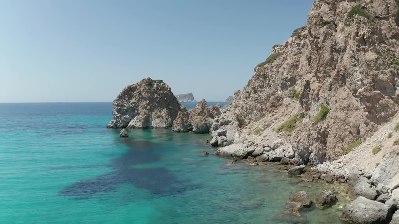 Stock Video Flying On The Rocky Shore Of A Turquoise Blue Sea Live Wallpaper For PC