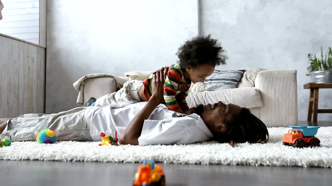 Stock Video Father Playing On The Carpet With His Little Son Live Wallpaper For PC