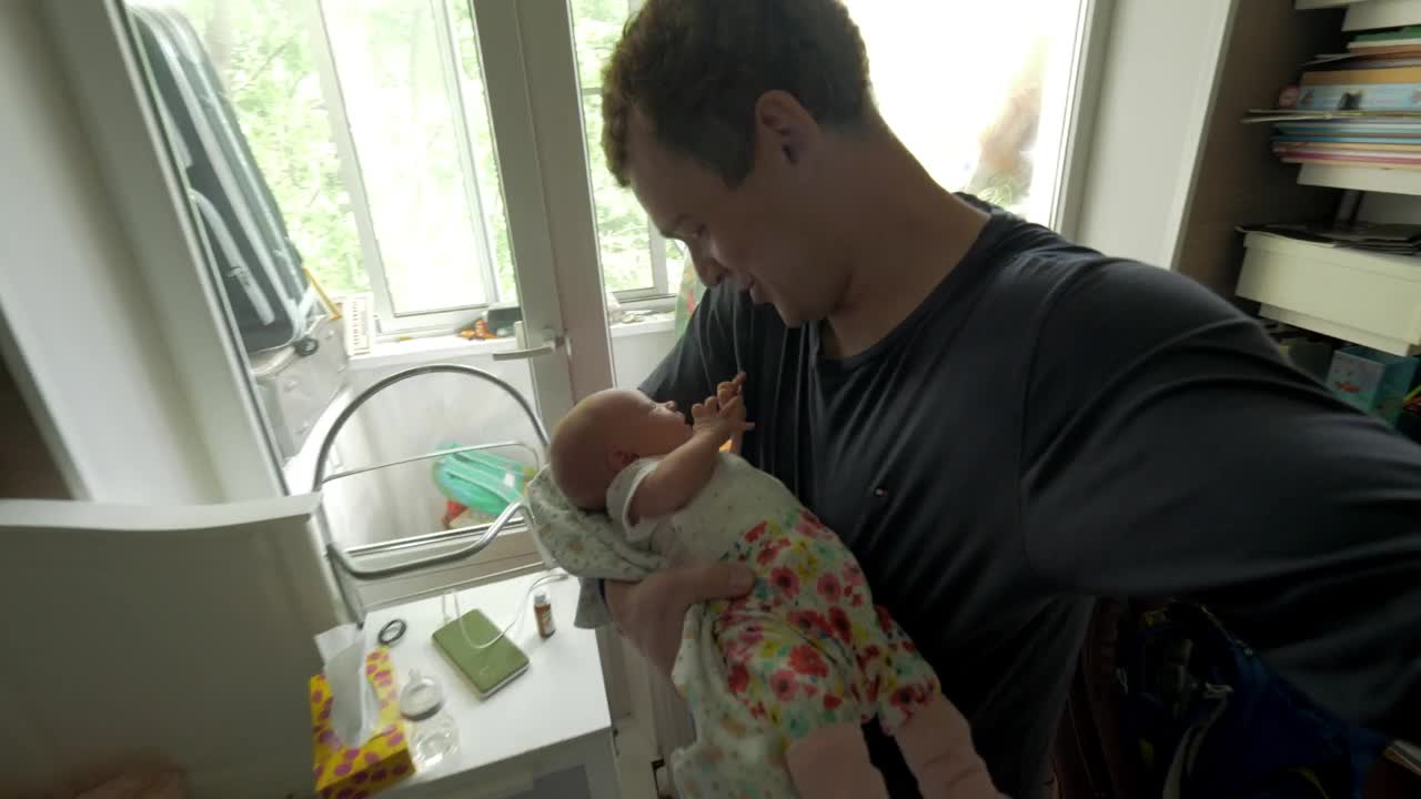 Stock Video Father Caring For His Newborn Baby Live Wallpaper For PC