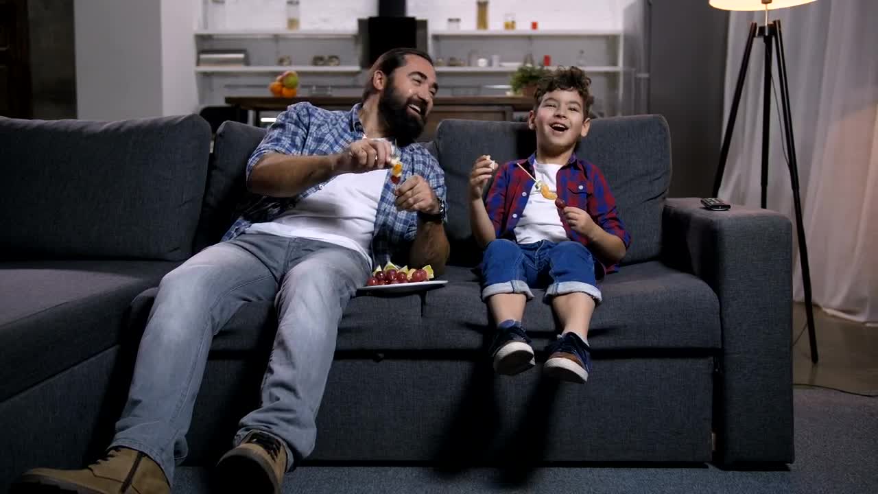 Stock Video Father And Son Laughing At The Tv Live Wallpaper For PC