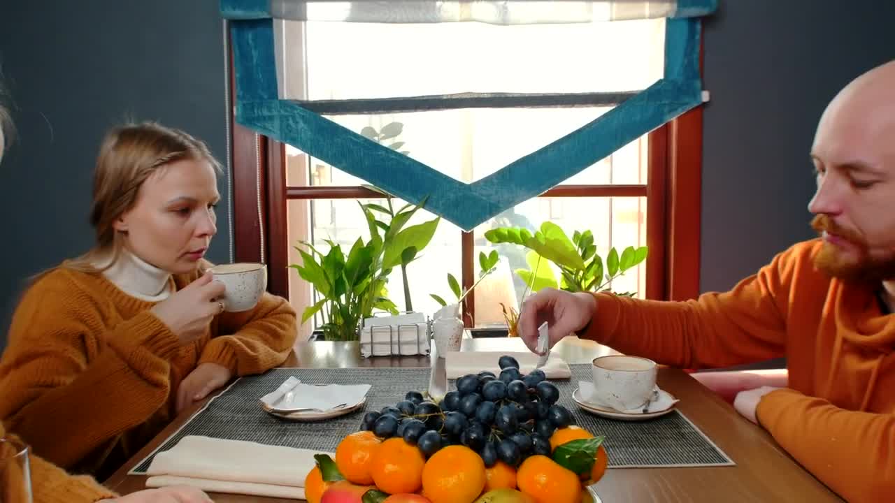 Stock Video Father And Her Daughters Drinking Coffee And Juice Live Wallpaper For PC