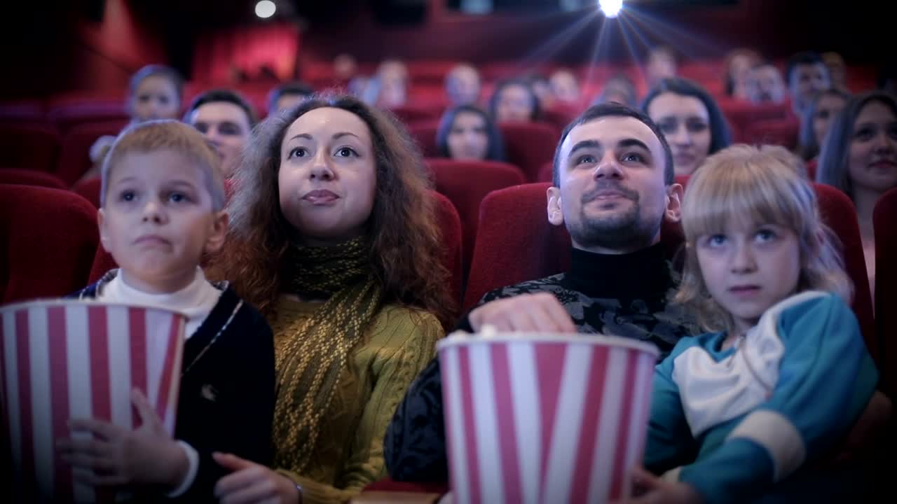 Stock Video Family Watching A Childrens Movie At The Cinema Live Wallpaper For PC