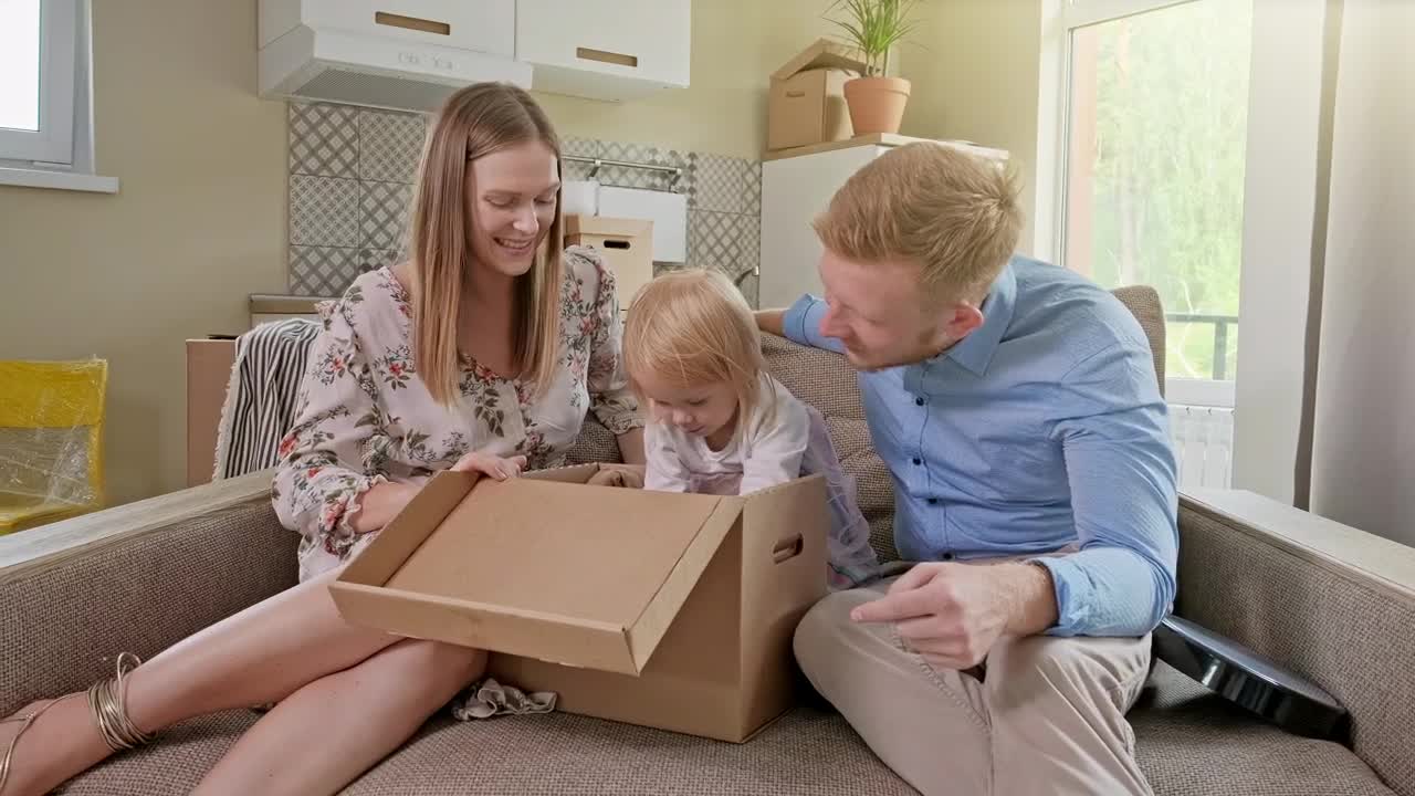 Stock Video Family Unpacking When Moving Into Their New Home Live Wallpaper For PC