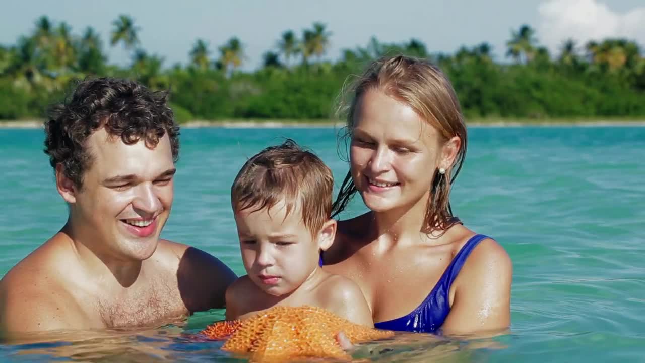 Stock Video Family Holding A Starfish Live Wallpaper For PC
