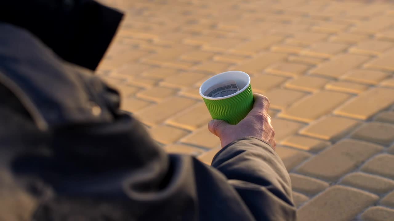 Stock Video Hand Of A Tramp Holding A Glass With Money Live Wallpaper For PC