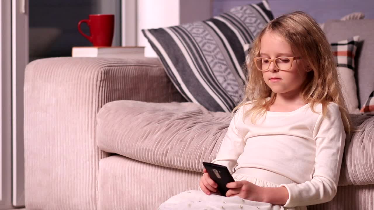 Stock Video Girl With Glasses Playing With A Smartphone Live Wallpaper For PC