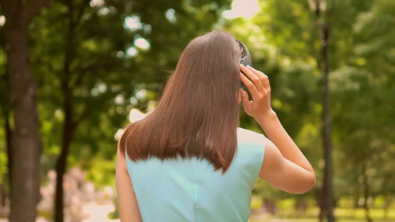 Stock Video Girl Walking In Nature With Music On Her Headphones Live Wallpaper For PC