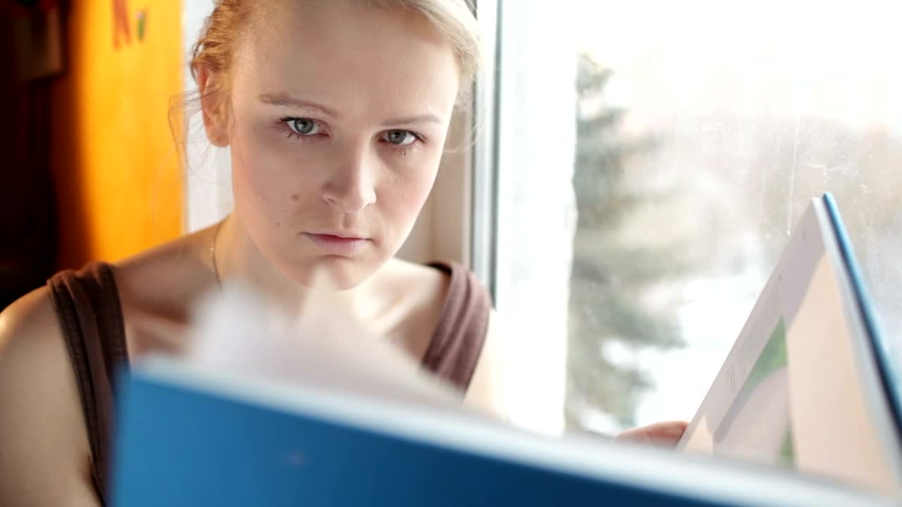 Stock Video Girl Reading A Large Book By The Window Live Wallpaper For PC