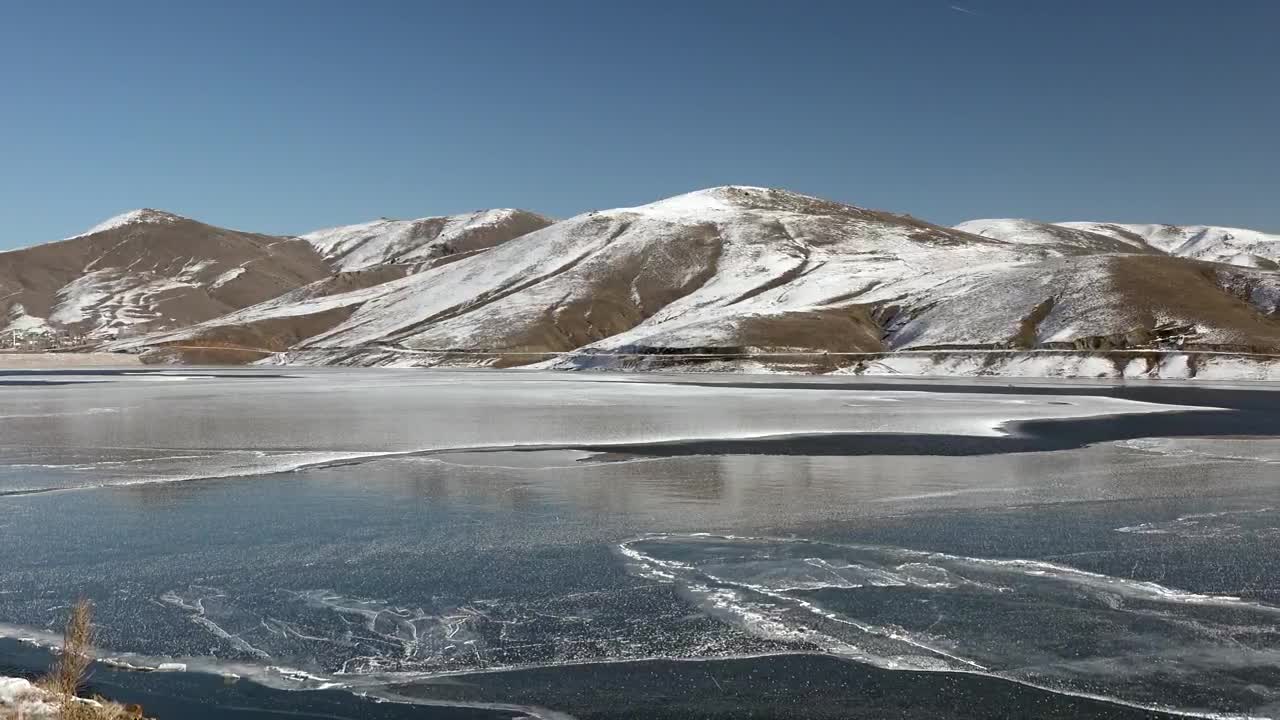 Stock Video Frozen Water Surface Of A Lake Near The Mountains Live Wallpaper For PC