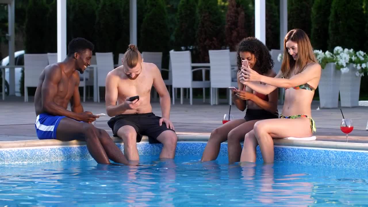 Stock Video Friends With Cell Phones Sitting On A Swimming Pool Live Wallpaper For PC
