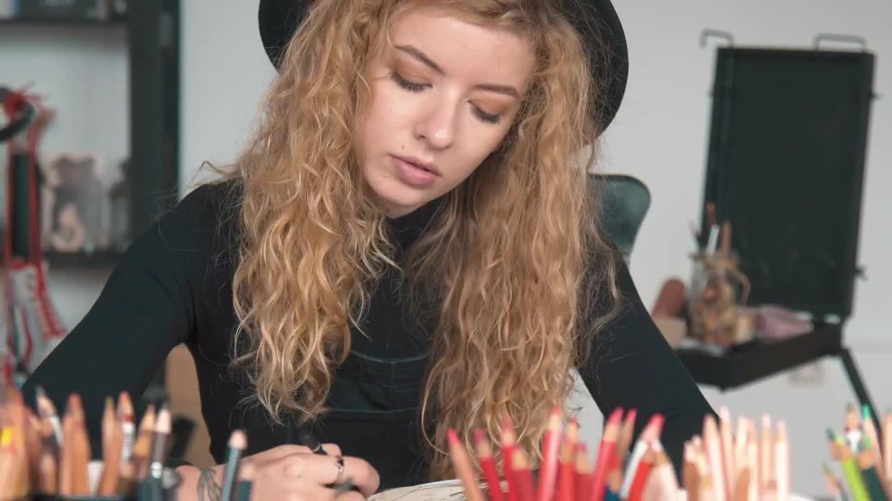Stock Video Inspired Artist Works On Illustration In Studio Animated Wallpaper