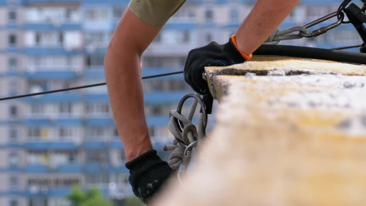 Stock Video Industrial Climber Adjusting Equipment To Work Animated Wallpaper