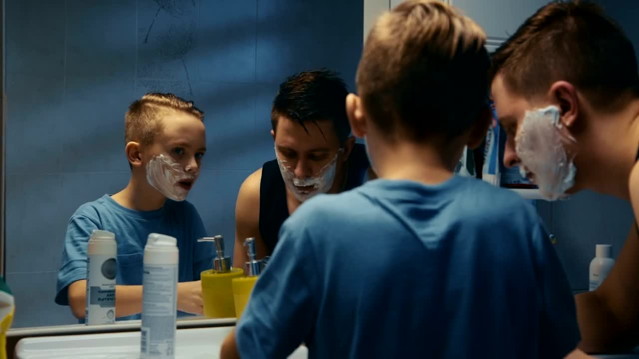 Stock Video I Father Teaching His Son How To Shave Animated Wallpaper