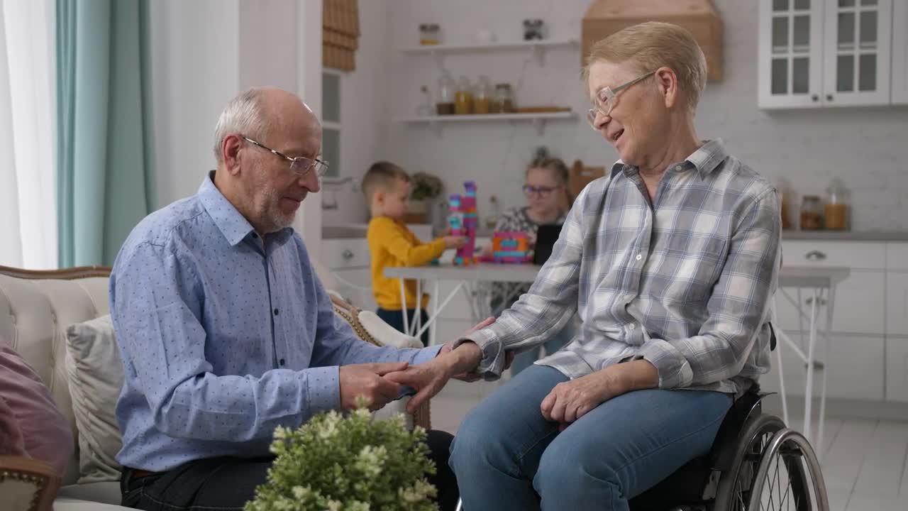 Stock Video Husband Caring For His Disabled Wife Animated Wallpaper