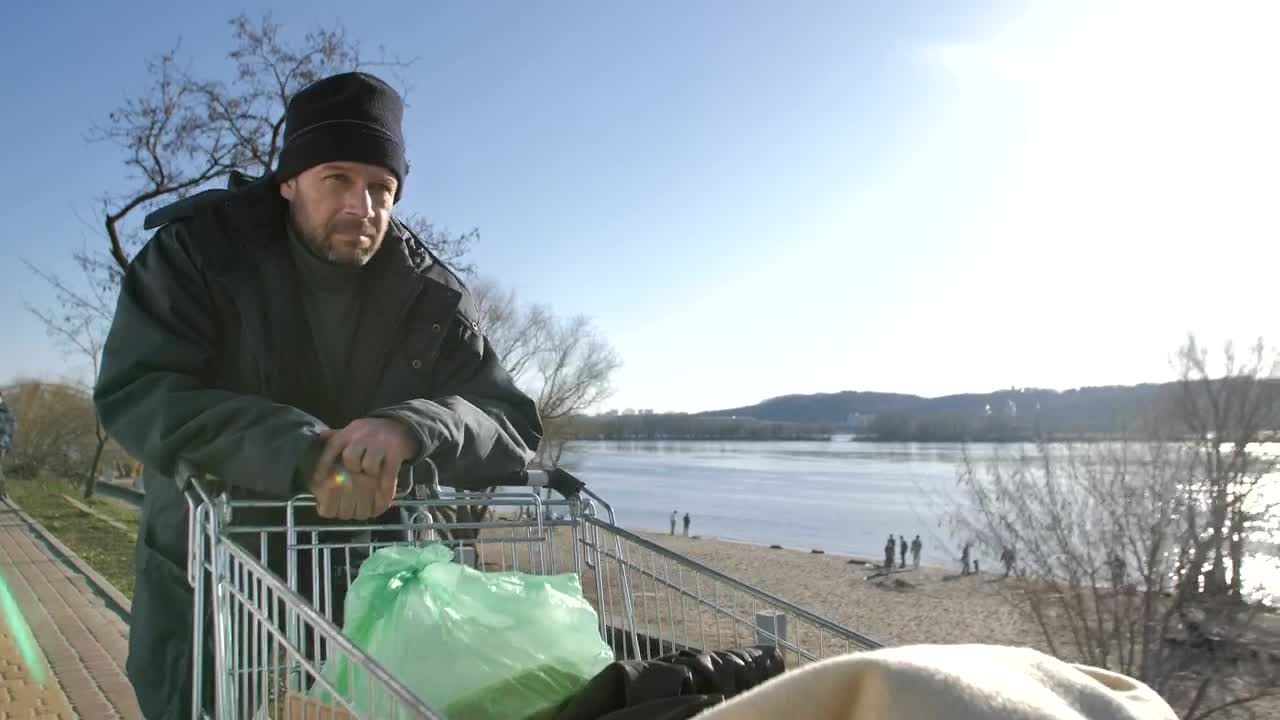 Stock Video Homeless Man With A Cart Of Plastic Bags Animated Wallpaper