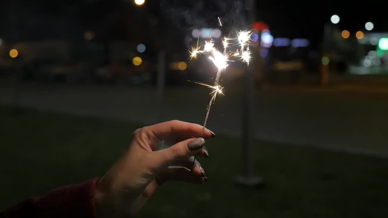 Stock Video Holding A Sparkler At Night Animated Wallpaper