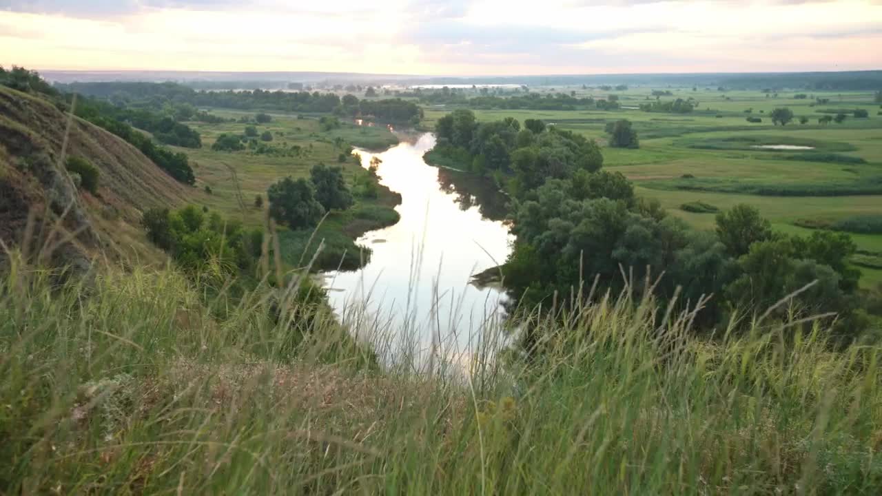 Stock Video High View Of A River Between Fields Animated Wallpaper