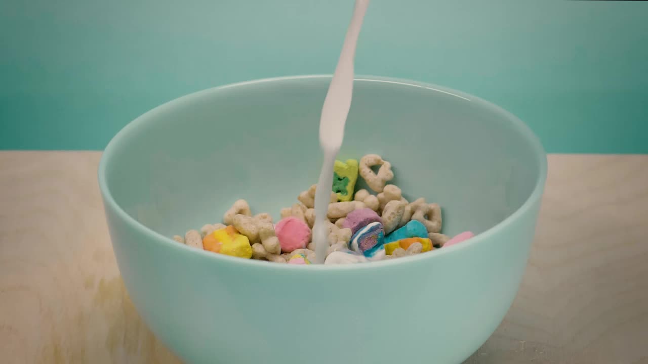 Stock Video Healthy Cereal In A Bowl While Pouring Milk Animated Wallpaper