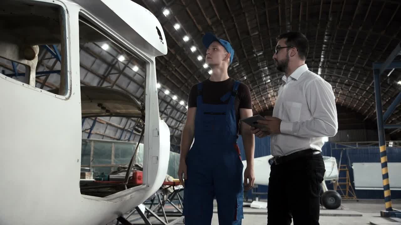 Stock Video Having A Conversation In The Hangar Animated Wallpaper