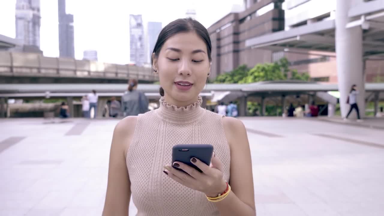 Stock Video Happy Woman Reading Messages On Her Cell Phone Animated Wallpaper