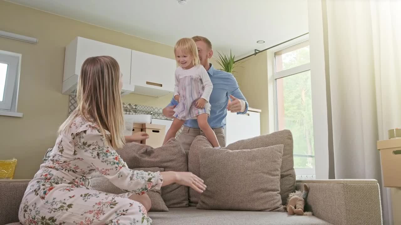 Stock Video Happy Parents Playing With Their Daughter Animated Wallpaper