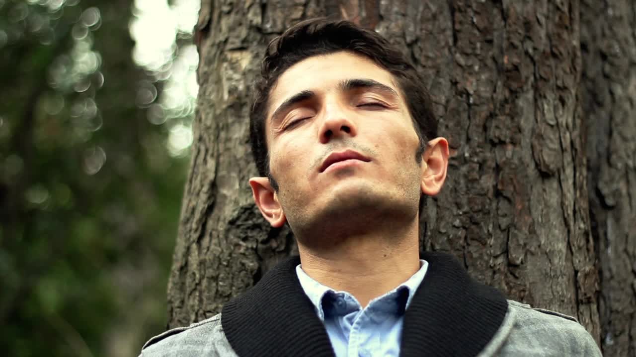 Stock Video Happy Man Relaxing In The Park Animated Wallpaper